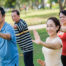 Vietamese men and women doing t'ai chi
