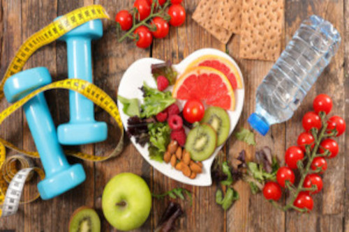 Photo of health foods, a water bottle, tape measure and hand weights