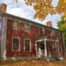 Picture of the Stone Tolan House in fall