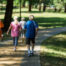 People walking on a sidewalk on a sunny day