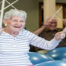 Picture of woman with drumsticks in her hands drumming on an exercise ball