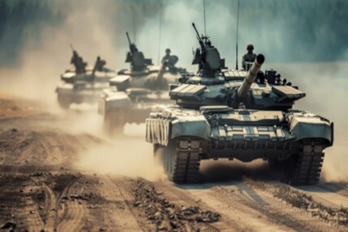 Photo of armored tanks with soldiers on top