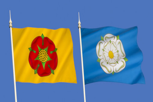 photo of two flags, one yellow with a red rose and one blue with a white rose. Depicting the war of the roses